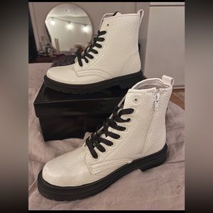 White and black snake skin combat boots